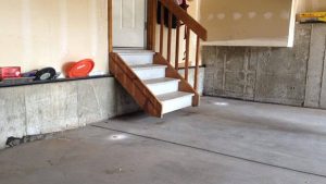 garage floor before garage leveling